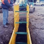 LITE guard standard shield lowered into trench by mini excavator